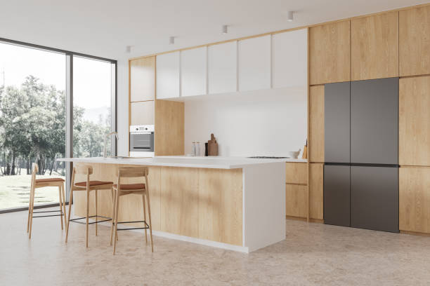 istock Island and cabinets in white and wooden kitchen interior 1890086084