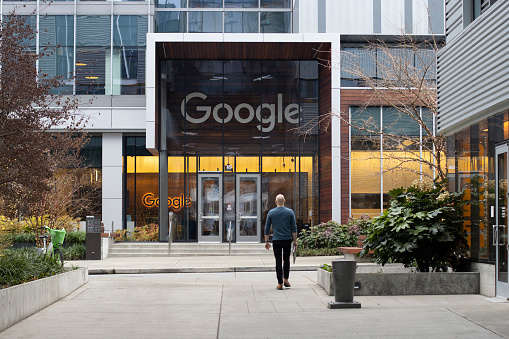 Seattle, WA, USA - Dec 21, 2023: A Googler walks back to Google's South Lake Union office in Seattle, Washington.