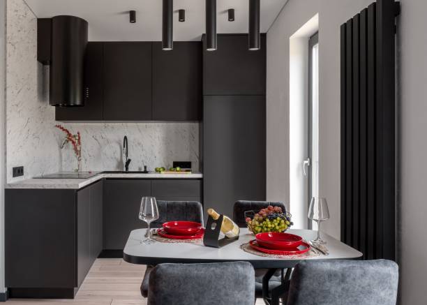 istock Black kitchen and dining room in gray color. 1890216861