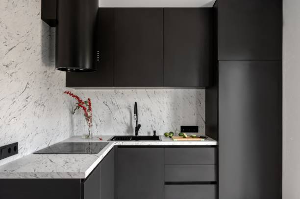 istock Black kitchen and dining room in gray color. 1890217377