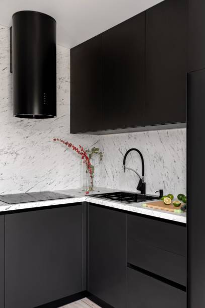 istock Black kitchen and dining room in gray color. 1890217385