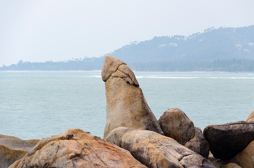 A captivating image of the famous Grandfather Rock (Hin Ta) of Koh Samui, known for its distinctive shape. This natural rock formation, set against the backdrop of the island's beautiful coastline, is a popular and intriguing attraction, drawing visitors for its unique geological and cultural significance.