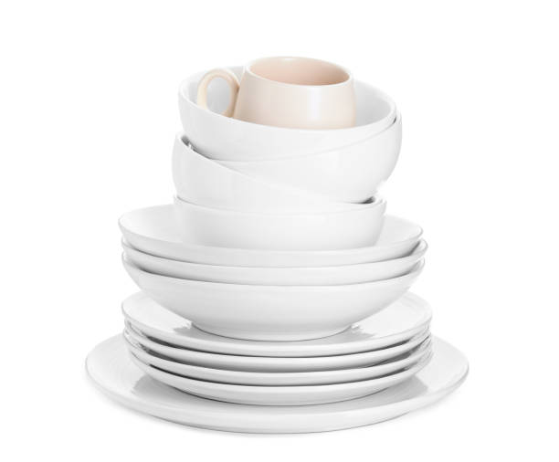 istock Beautiful ceramic plates, bowls and cup isolated on white 1890284636