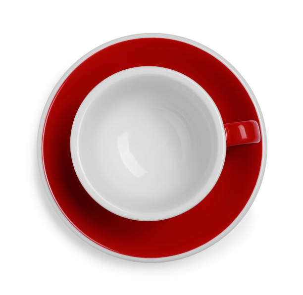 istock Red ceramic cup with saucer isolated on white 1890286718