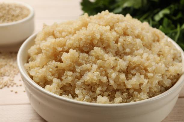 istock Tasty quinoa porridge in bowl on table, closeup 1890318448
