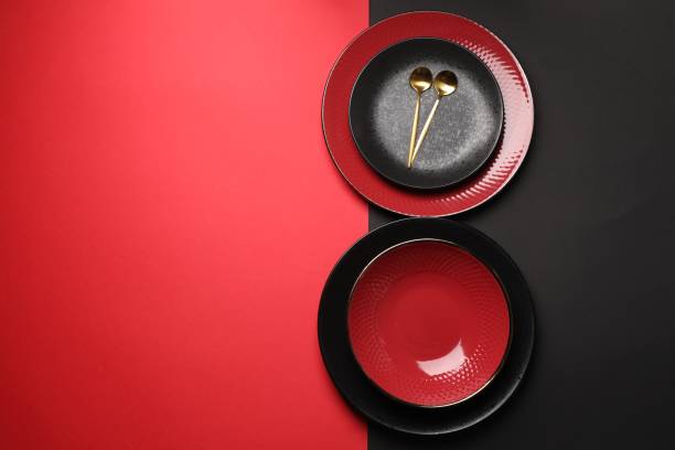 istock Stylish table setting with plates and spoons on color background, top view. Space for text 1890330746