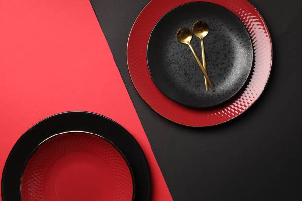 istock Stylish table setting with plates and spoons on color background, top view 1890330909