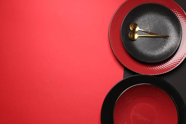 istock Stylish table setting with plates and spoons on color background, top view. Space for text 1890330926
