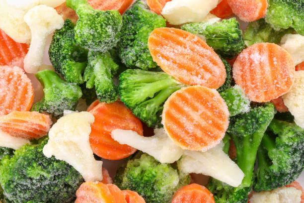 istock Mix of different frozen vegetables as background, top view 1890342638