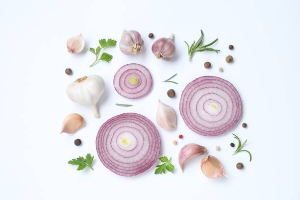 istock Fresh garlic, onion rings and spices on white table, flat lay 1890346952
