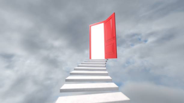 istock White staircase to a open red door against a colorful sky 1890369954