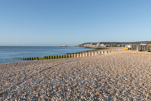 The North East Beach at Eastbourne, Sussex, England  with the town and Pier in the distance