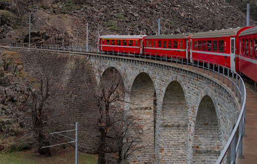 Bernina red train on old bridge