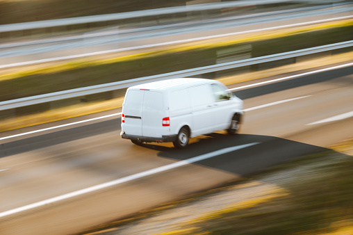 A van in motion on a highway