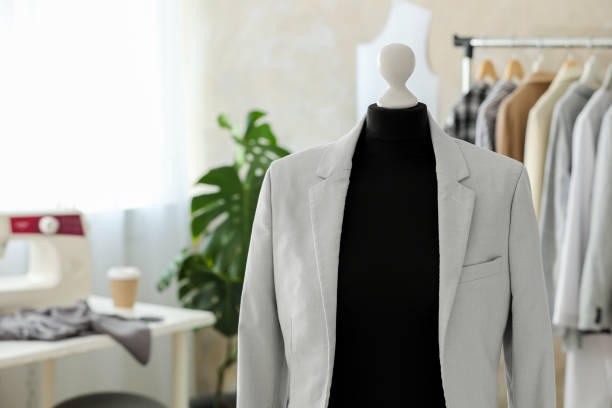 istock Mannequin with stylish jacket in tailor shop, space for text 1890482315