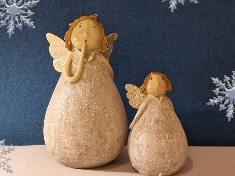 Two pottery angels in close up