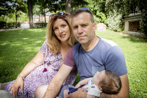 istock Family sitting on the grass 1890520188