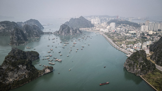 Ha Long, a city on Vietnam’s northern coast, is a jumping-off point for Ha Long Bay, a broad inlet of dramatic, often mist-covered limestone islands.