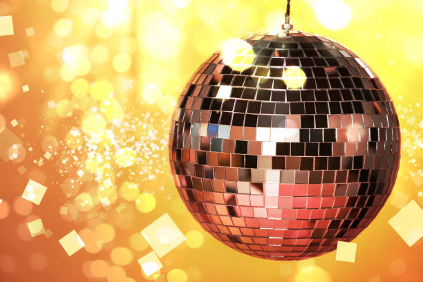 istock Shiny disco ball under golden lights, space for text. Bokeh effect 1890524320