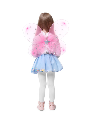Little girl in fairy costume with pink wings on white background, back view