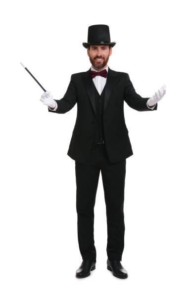 istock Happy magician in top hat holding wand on white background 1890654199