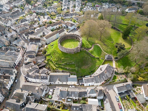 18th April 2023: Aerial drone view of the Saxon town of Totnes, in Devon, with it's 900 year old Castle, built at the time of William the Conqueror. It is a European motte-and-bailey castle, with a stone keep. From the turret walls you can see views across the town and nearby River Dart.