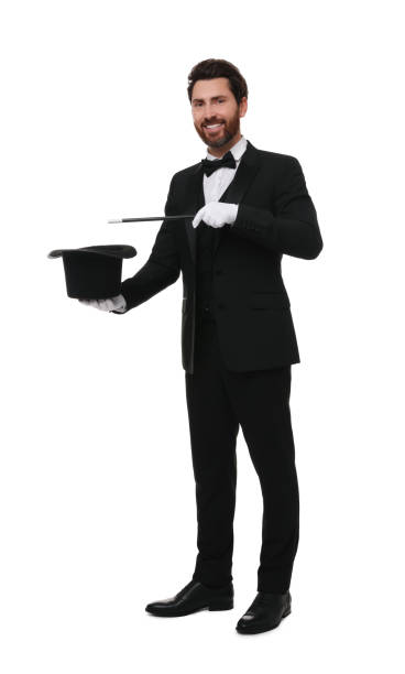 istock Happy magician showing magic trick with top hat on white background 1890656047