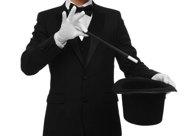 istock Magician showing magic trick with top hat on white background, closeup 1890658085