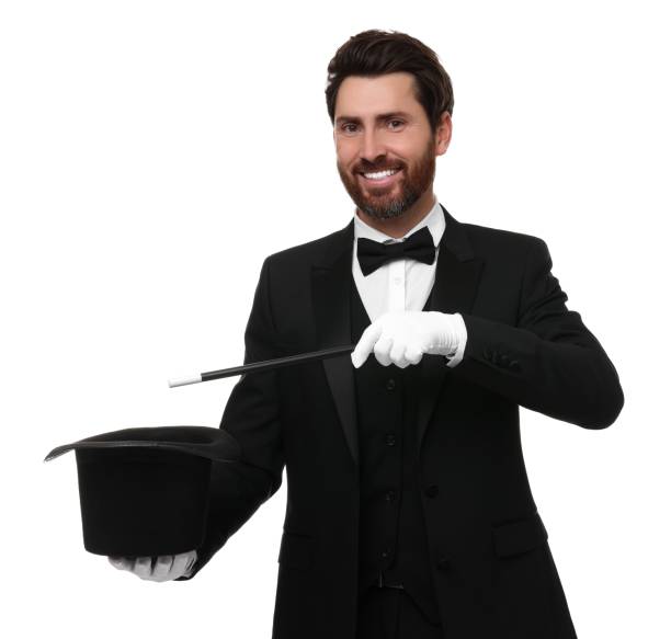istock Happy magician showing magic trick with top hat on white background 1890661519
