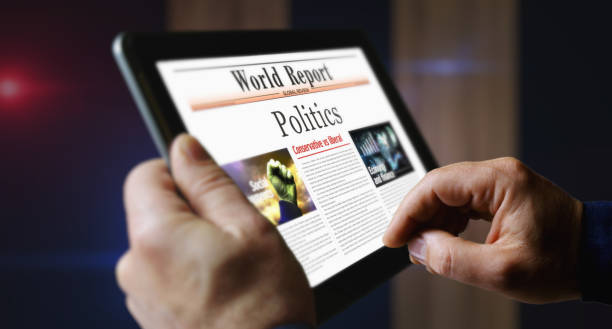 istock Politics newspaper on mobile tablet screen 1890684243