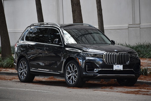 Houston, TX USA 10-26-2023 - A new black BMW X7 parked in the downtown district of Houston.