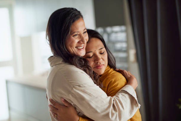 istock Two happy women hugging each other. 1890894554
