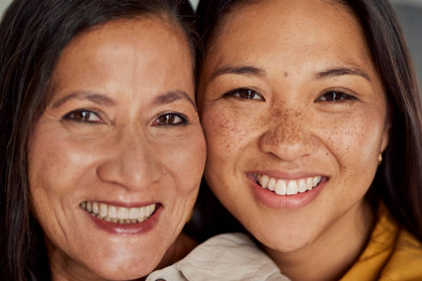 istock Asian Mom And Daughter Smiling Together 1890894570
