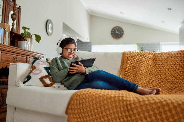 istock Girl Watching Educational Content On Tablet At Home 1890894898