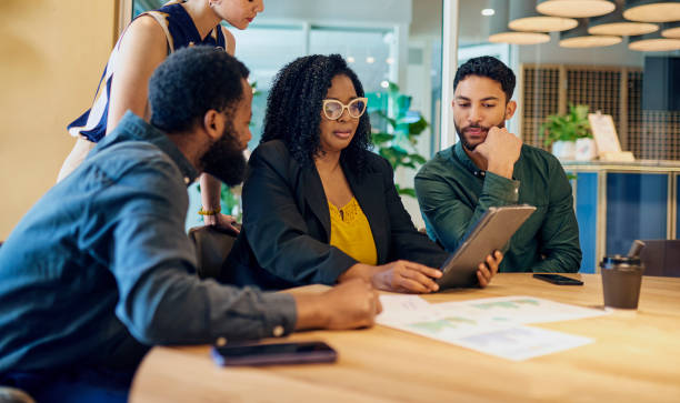 istock Diverse Colleagues Collaborating On Business Strategy In Modern Office 1890897748