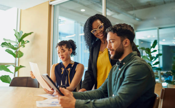 istock Diverse Colleagues Working Together In Conference Room 1890897785