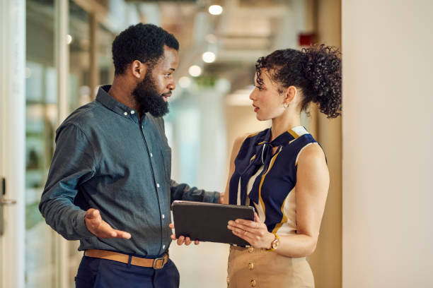 istock Colleagues discussing ideas in modern office space 1890898304