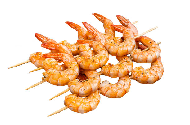 BBQ Roasted shrimps prawns on skewers Isolated on white background, top view.