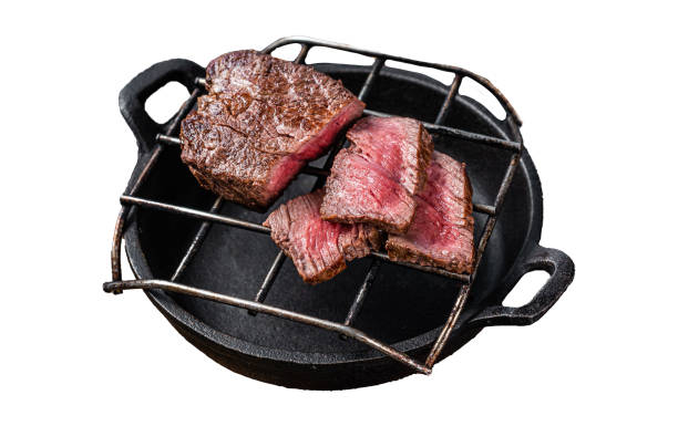 istock Grilled fillet mignon beef steak on a grill.  Isolated on white background, top view. 1890907471