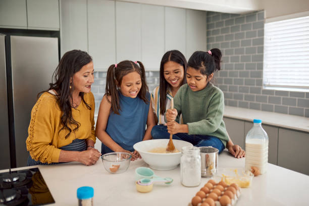 istock Happy Family Baking Together In Kitchen 1890910834
