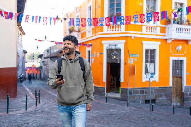 istock Young Hispanic man sightseeing in La Ronda streets, Quito, Ecuador 1890959910
