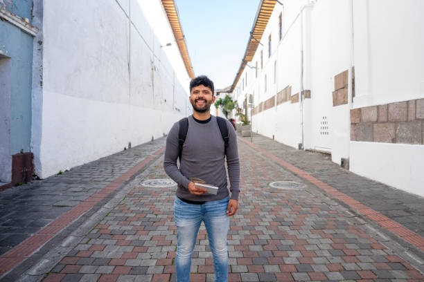 istock Young Latin man sightseeing in Arco de la Reina, Quito, Ecuador 1890960202