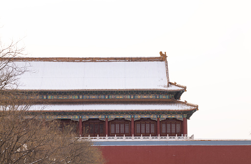 Tower building in Forbidden City, Beijing, China, with snow