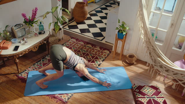 Girl Practicing Vinyasa Yoga Flow on Mat in the Living Room