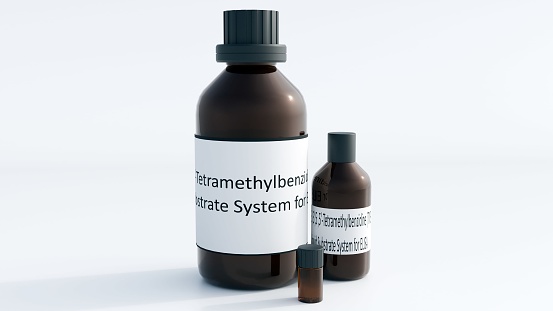 3d rendering of isolated 3,3′,5,5′-Tetramethylbenzidine or TMB inside of amber glass bottle on the white background