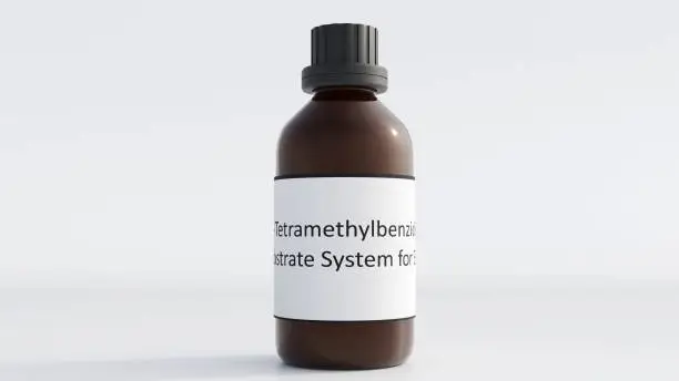 Photo of isolated tetramethylbenzidine or TMB inside of amber glass bottle