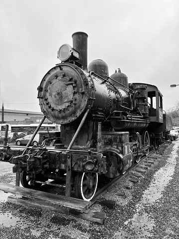 PATERSON, NJ USA - DECEMBER 27, 2023: Historical artifact of an old railroad steam locomotive reminiscence of the Industrial Age.