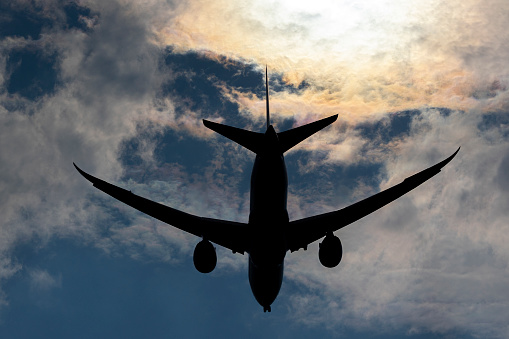 Silhouette of a Passenger jet landing