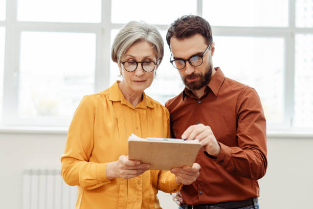 istock Focused business people, successful colleagues planning startup 1891128176