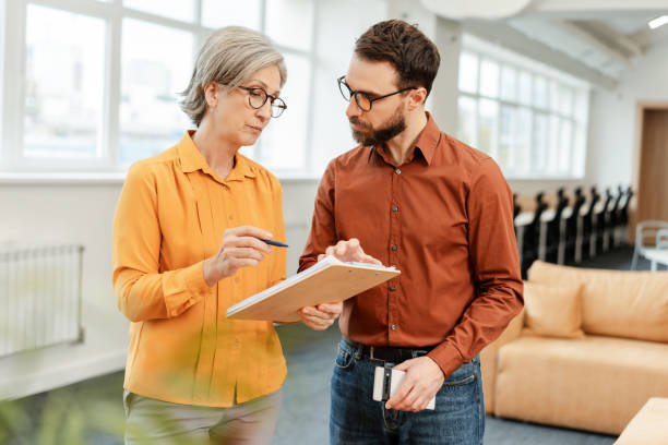 istock Confident business people, successful colleagues, workers talking, sharing ideas 1891128180
